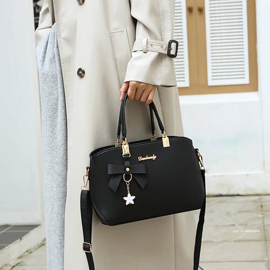 Chic shoulder bag for women featuring a bowknot accent, spacious compartments, and versatile style for work, outings, or daily wear. - WAREHOUSE SHOP