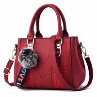 Leather embroidery messenger bag with stylish design, spacious handbag, and chic hair ball detail – perfect everyday sac à main. - WAREHOUSE SHOP