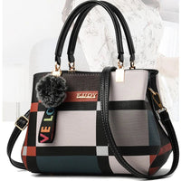 Stylish women’s designer handbag in PU leather with hairball detail, versatile crossbody and top - handle design, perfect for daily use. - WAREHOUSE SHOP